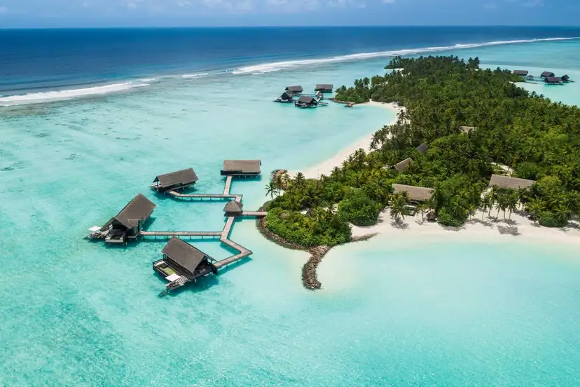Overwater villas surrounded by the turquoise Maldives lagoon